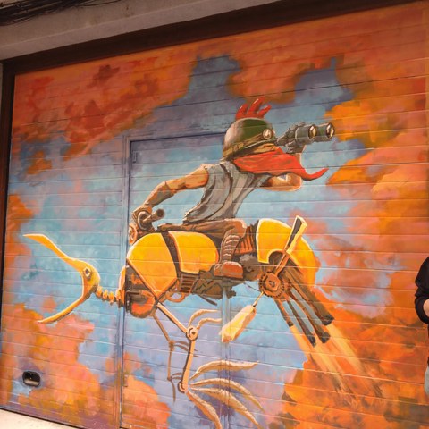 Ein Graffiti im Barrio del Oeste, das vom Künstler CG Castellano auf ein Garagentor gemalt wurde. Vergrösserte Ansicht